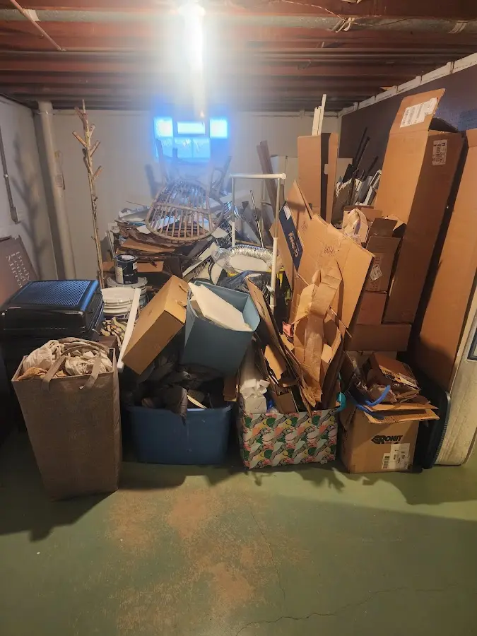 Roll-off dumpster container at job site for 2 Yard Dumpster Rental in Canton